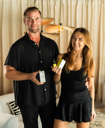 The glow couple behind Sunslut — serving sunshine, sarcasm, and self-tan in a bottle.